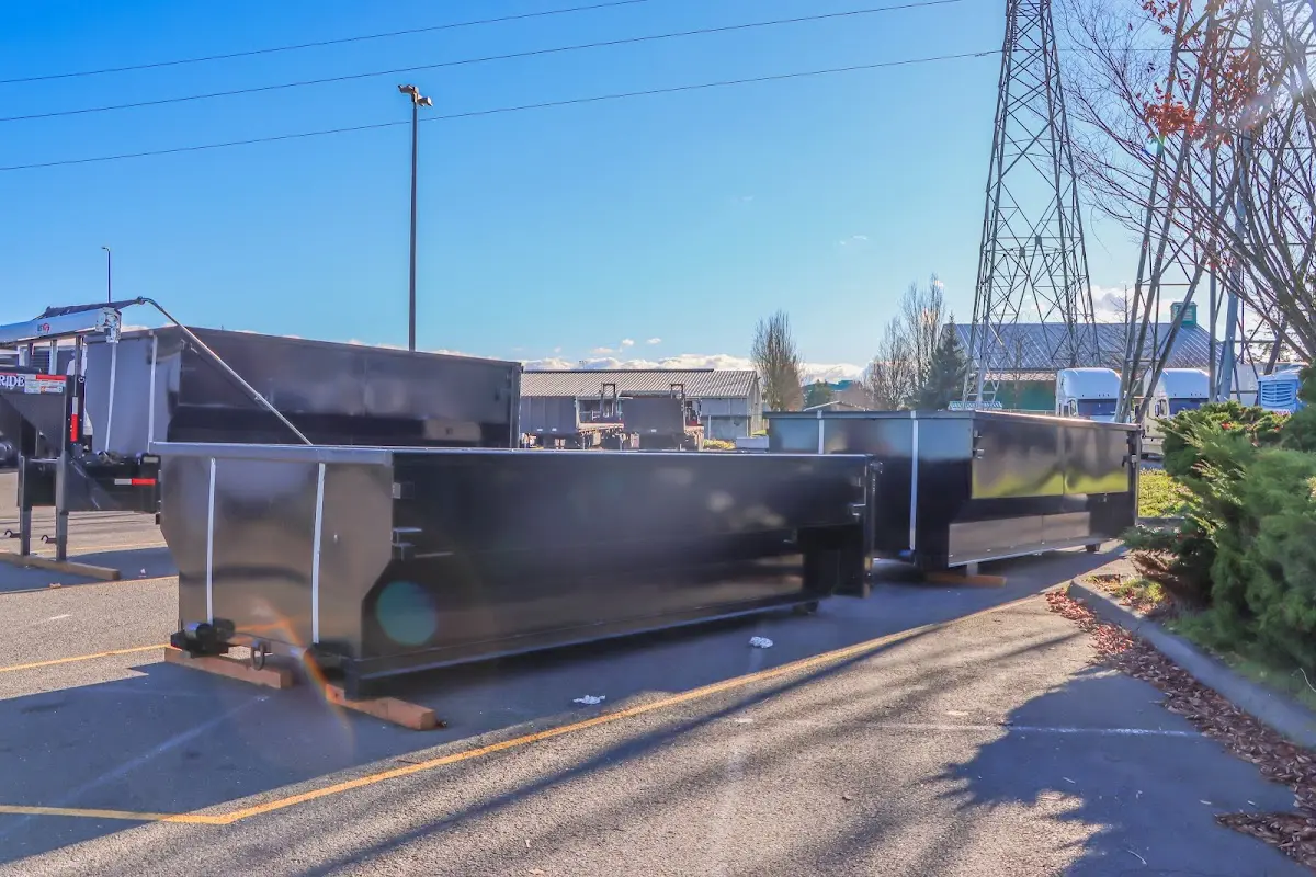 Roll-off dumpster ready for waste disposal at job site for Construction Dumpster Rental in Old Westbury